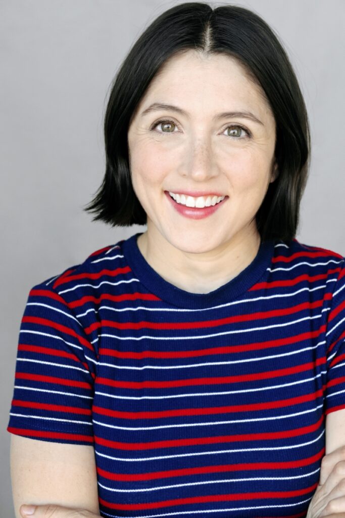 smiling woman in striped red and blue t-shirt